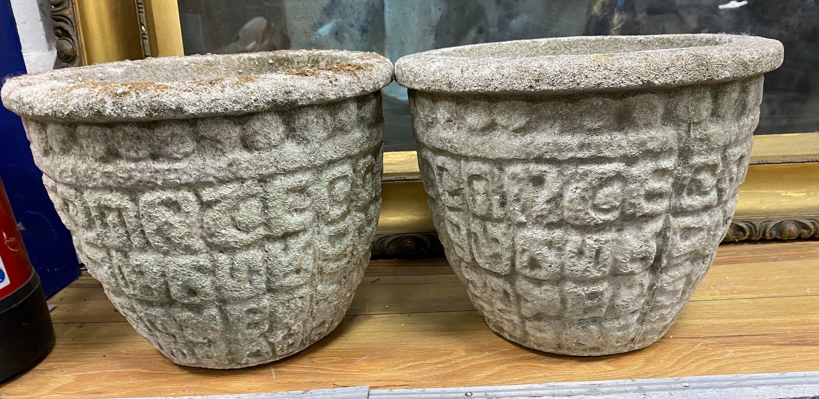 A pair of circular reconstituted stone garden planters, diameter 30cm, height 24cm